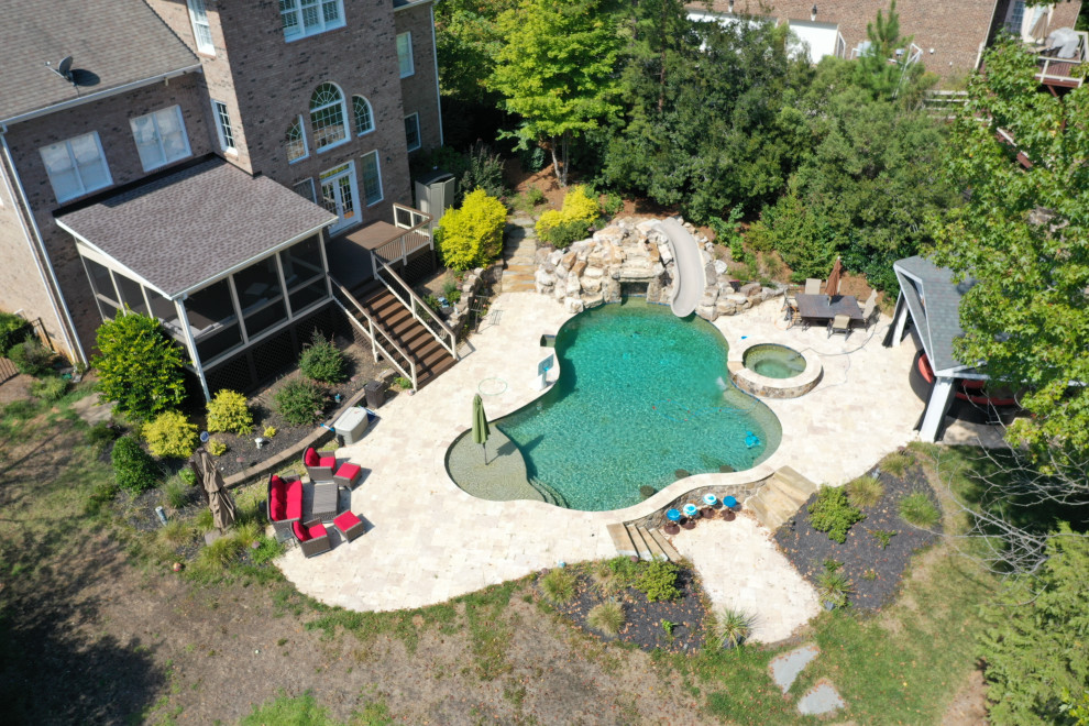 Inspiration for a mid-sized backyard deck remodel in Charlotte with no cover