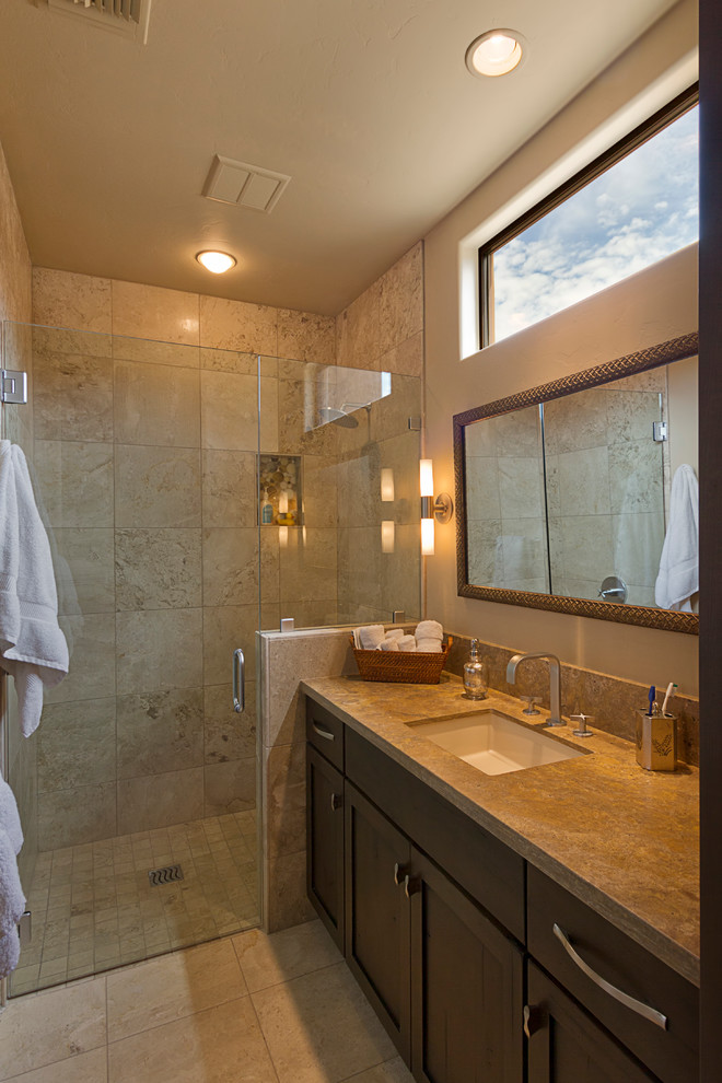Walk-in shower - mid-sized transitional beige tile walk-in shower idea in Phoenix with an undermount sink, shaker cabinets, dark wood cabinets and granite countertops