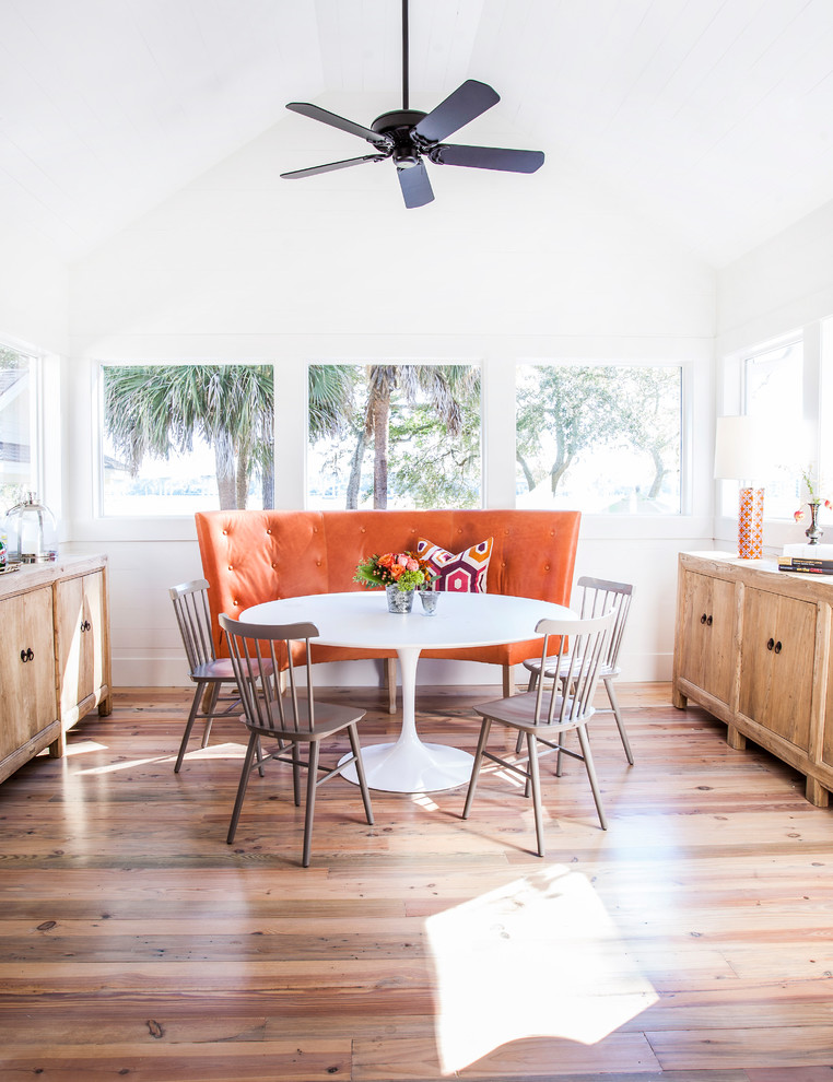 Inspiration for a beach style dining room in Atlanta with white walls, light hardwood floors and no fireplace.