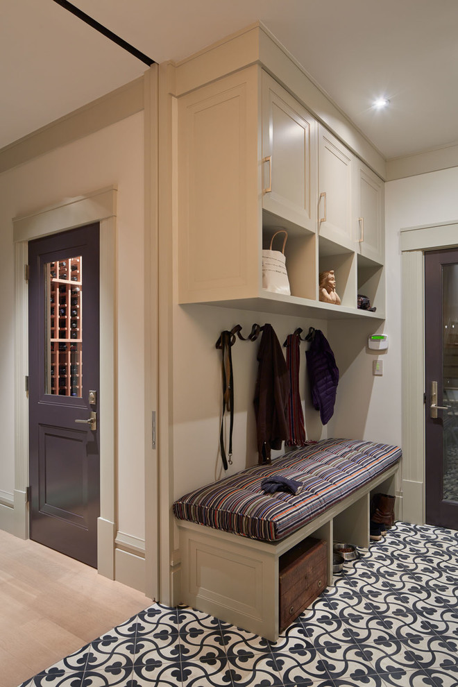 Design ideas for a transitional mudroom in San Francisco with light hardwood floors and white walls.