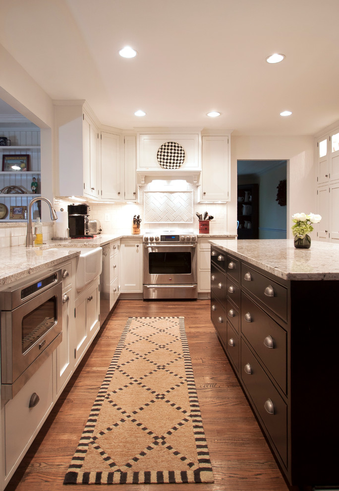 Transitional u-shaped eat-in kitchen photo in DC Metro with a farmhouse sink, beaded inset cabinets, white cabinets, granite countertops, white backsplash, subway tile backsplash and stainless steel appliances