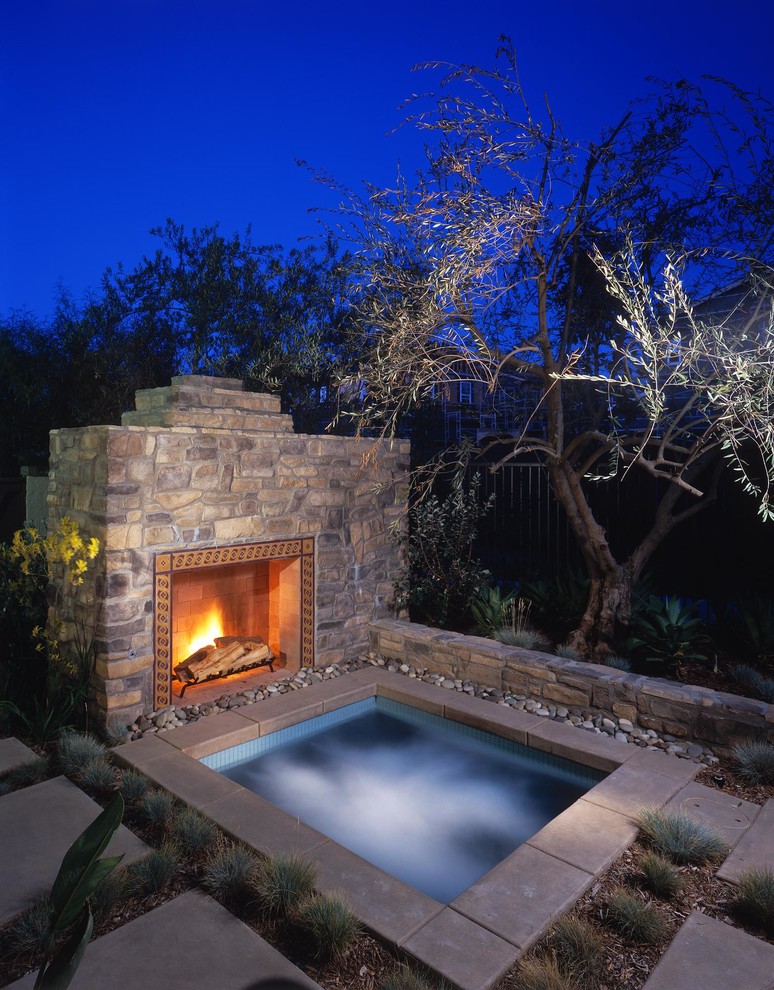 Photo of a country backyard rectangular pool in San Diego with a hot tub.