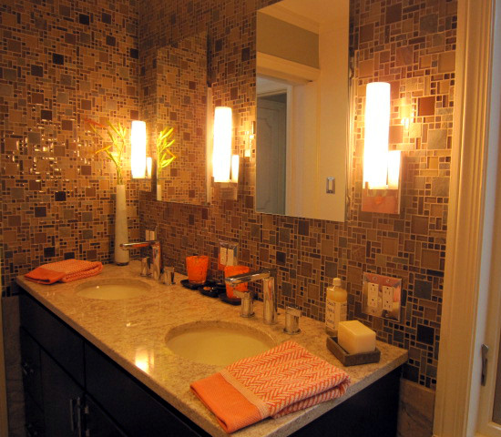 This is an example of a mid-sized contemporary 3/4 bathroom in Chicago with flat-panel cabinets, dark wood cabinets, an alcove shower, a one-piece toilet, multi-coloured tile, mosaic tile, brown walls, porcelain floors, an undermount sink, engineered quartz benchtops, brown floor and a hinged shower door.
