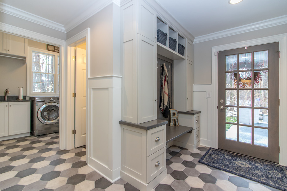 Design ideas for a mid-sized country mudroom in Columbus with grey walls, ceramic floors, a single front door, a glass front door and multi-coloured floor.