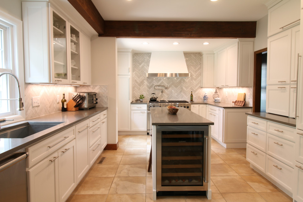 Eat-in kitchen - mid-sized u-shaped ceramic tile, beige floor and exposed beam eat-in kitchen idea in Denver with a single-bowl sink, flat-panel cabinets, white cabinets, quartz countertops, gray backsplash, marble backsplash, stainless steel appliances, an island and gray countertops