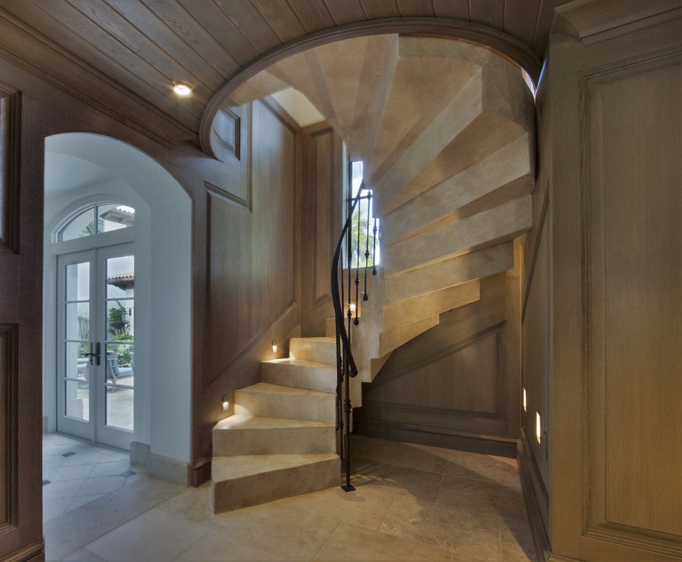 Inspiration for a small transitional concrete spiral staircase remodel in Miami with concrete risers