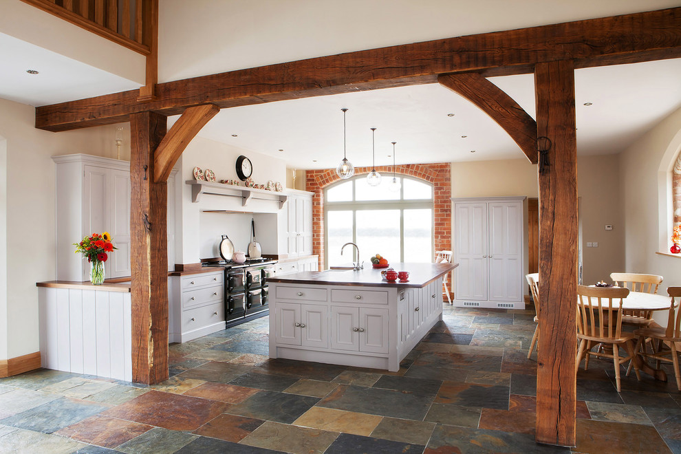 Design ideas for a country kitchen in Other with multi-coloured floor.
