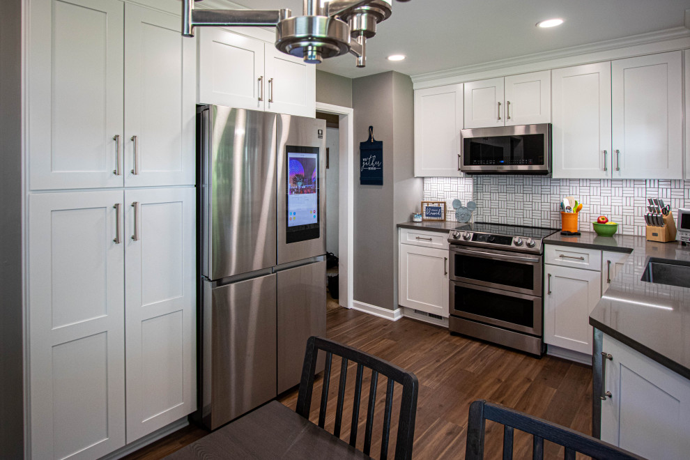 White Kitchen with White Tile Backsplash and Quartz Countertop ...