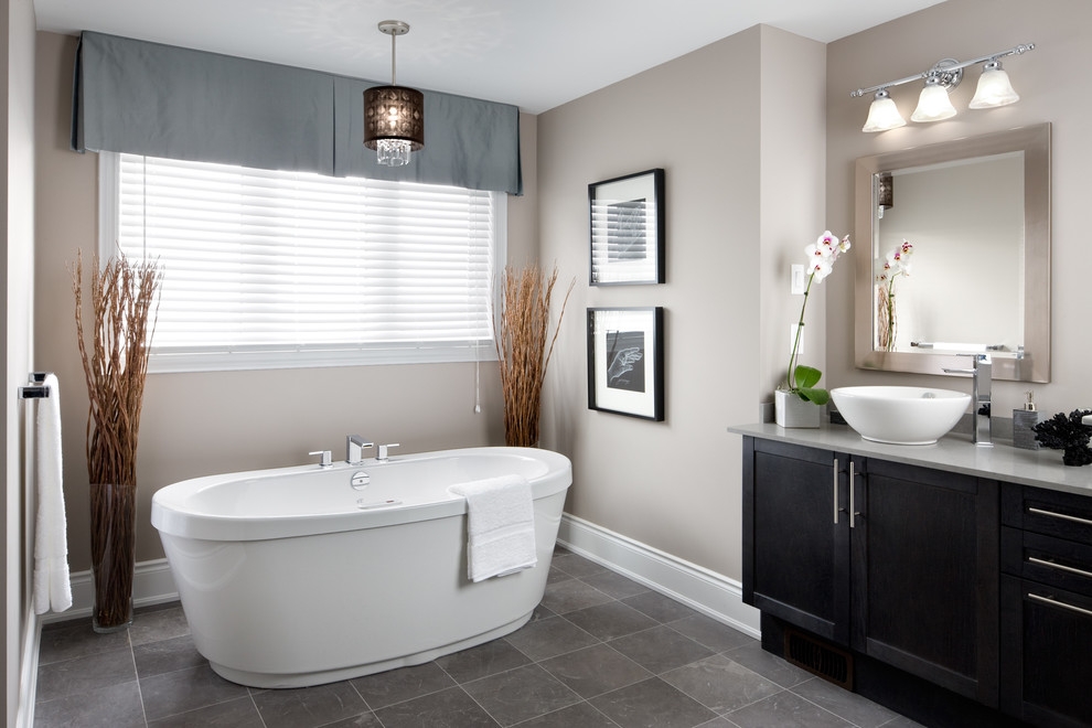 Inspiration for a transitional bathroom in Toronto with a freestanding tub and a vessel sink.