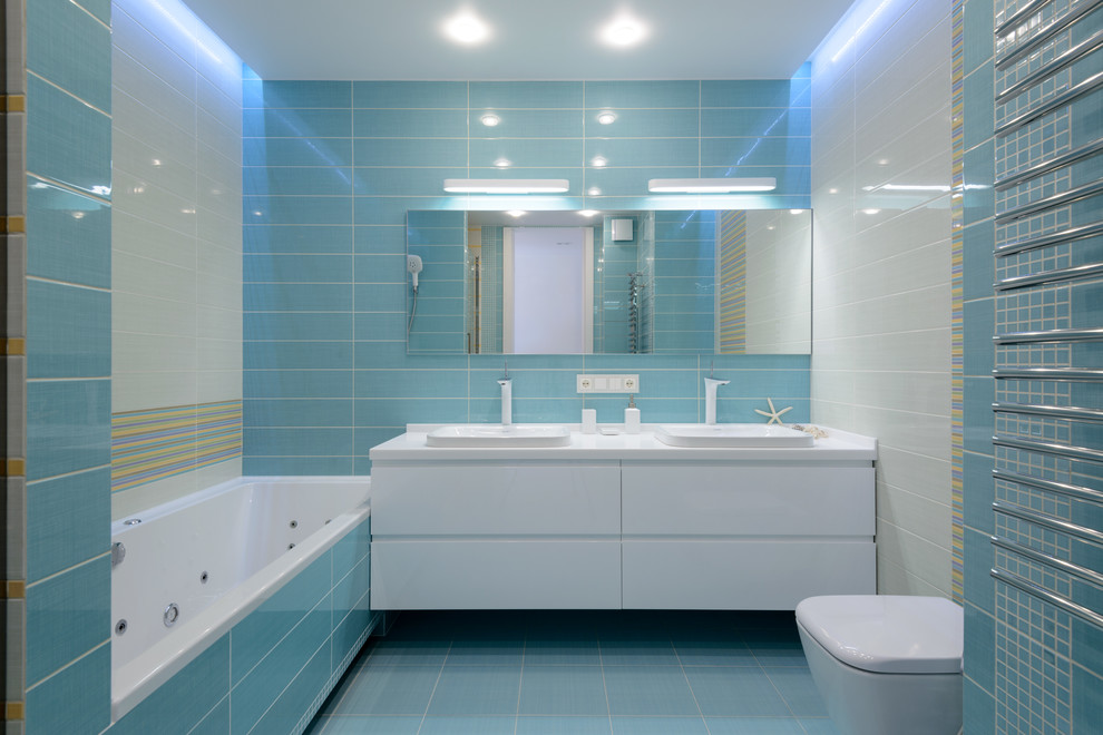 Mid-sized contemporary bathroom in Novosibirsk with an alcove shower, a wall-mount toilet, ceramic tile, a drop-in sink and an alcove tub.