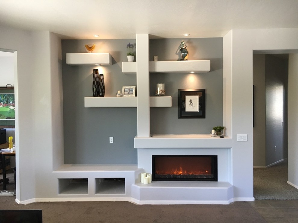 Mid-sized trendy open concept carpeted and brown floor living room photo in Phoenix with gray walls, a standard fireplace and a media wall