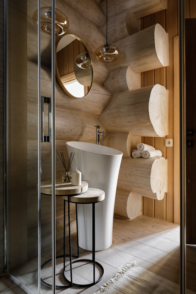 Photo of a large country bathroom in Other with porcelain tile, beige walls, porcelain floors, an integrated sink, beige floor and wood walls.