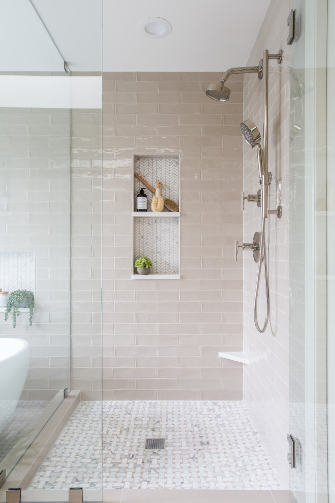 Photo of a mid-sized transitional master bathroom in Seattle with shaker cabinets, grey cabinets, a freestanding tub, gray tile, ceramic tile, porcelain floors, an undermount sink, engineered quartz benchtops, a hinged shower door, white benchtops, a niche and a double vanity.