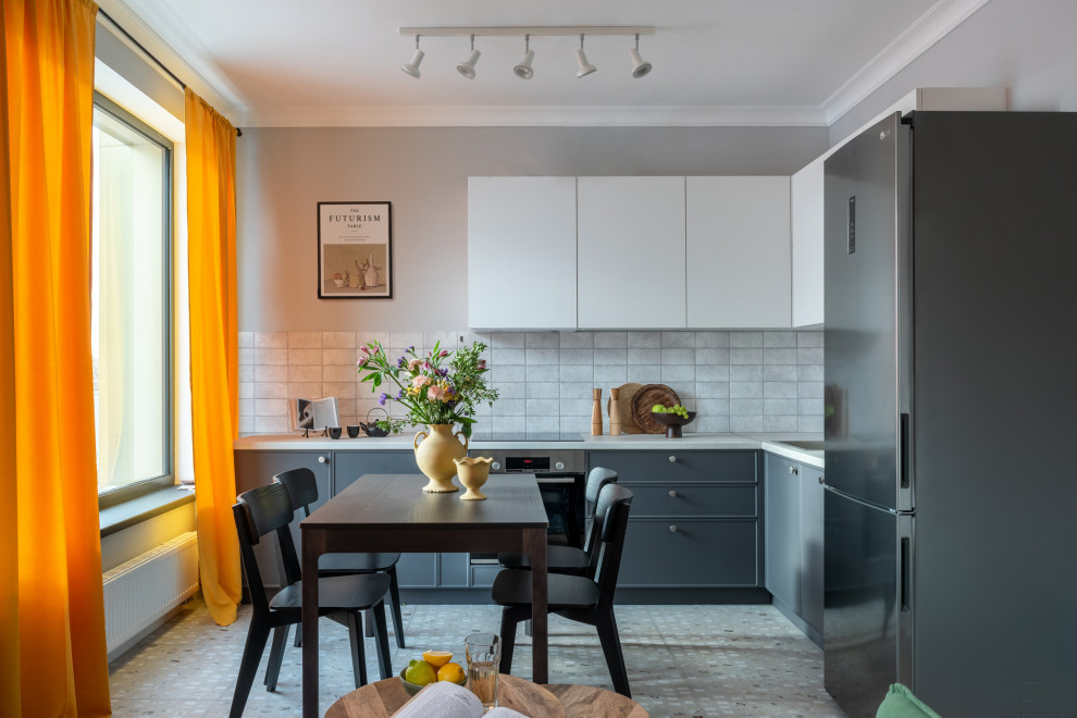 This is an example of a contemporary l-shaped kitchen in Moscow with a built-in sink, flat-panel cabinets, grey cabinets, stainless steel appliances, no island, grey floors and white worktops.