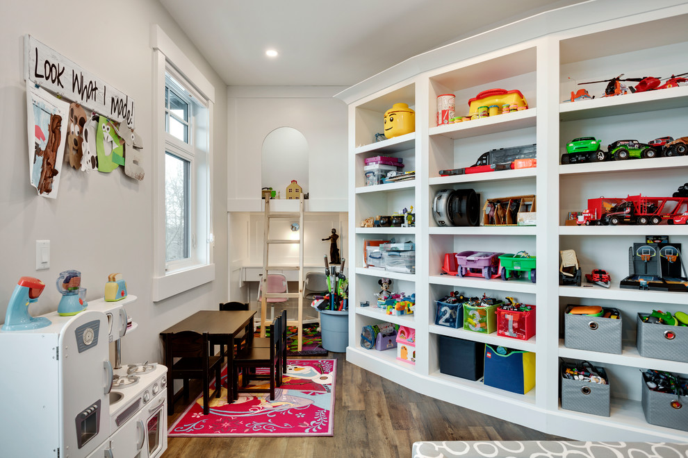 Design ideas for an expansive transitional gender-neutral kids' playroom for kids 4-10 years old in Calgary with grey walls, vinyl floors and brown floor.