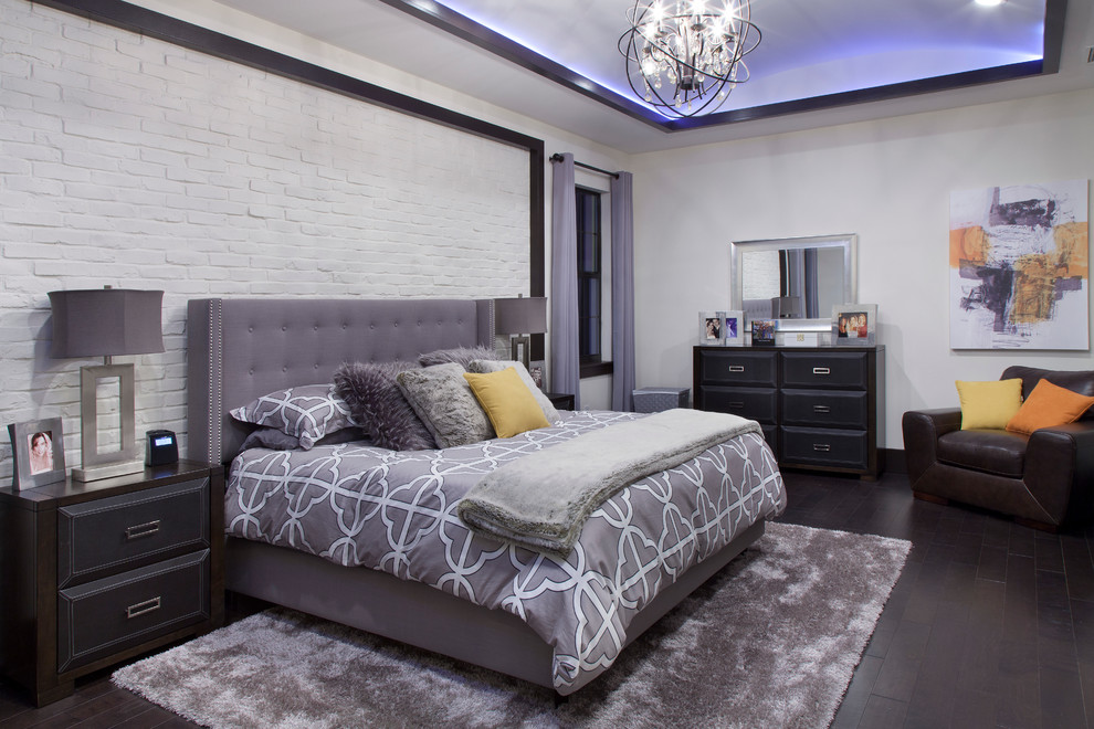 Photo of a mid-sized contemporary master bedroom in Orlando with white walls and dark hardwood floors.