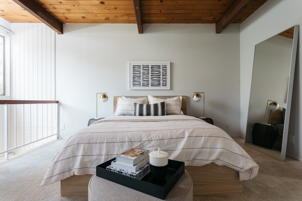 Design ideas for a midcentury bedroom in Los Angeles with white walls, carpet and grey floor.