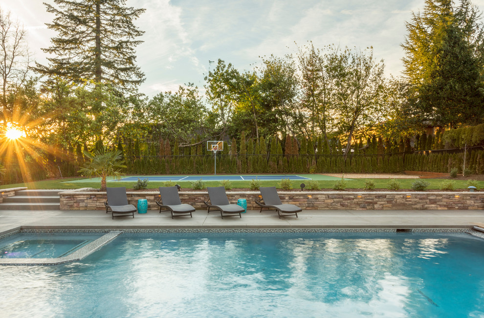 Inspiration for a huge transitional backyard concrete and rectangular lap hot tub remodel in Portland