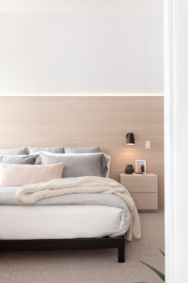 Design ideas for a mid-sized scandinavian master bedroom in Vancouver with white walls, carpet, grey floor and panelled walls.