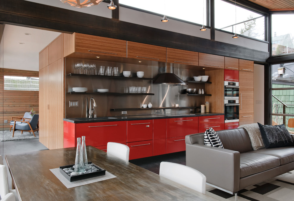Inspiration for an industrial single-wall open plan kitchen in Seattle with open cabinets, red cabinets, metallic splashback, metal splashback and panelled appliances.