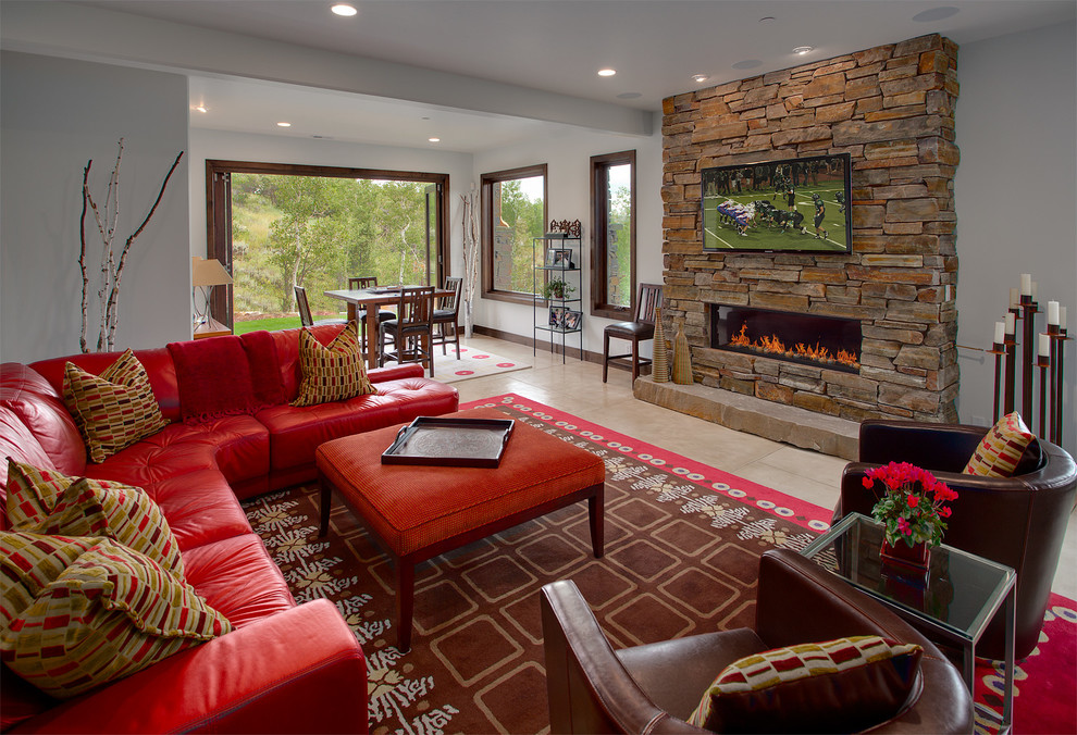 Expansive transitional formal open concept living room in Salt Lake City with grey walls, a ribbon fireplace, a stone fireplace surround, a wall-mounted tv and ceramic floors.