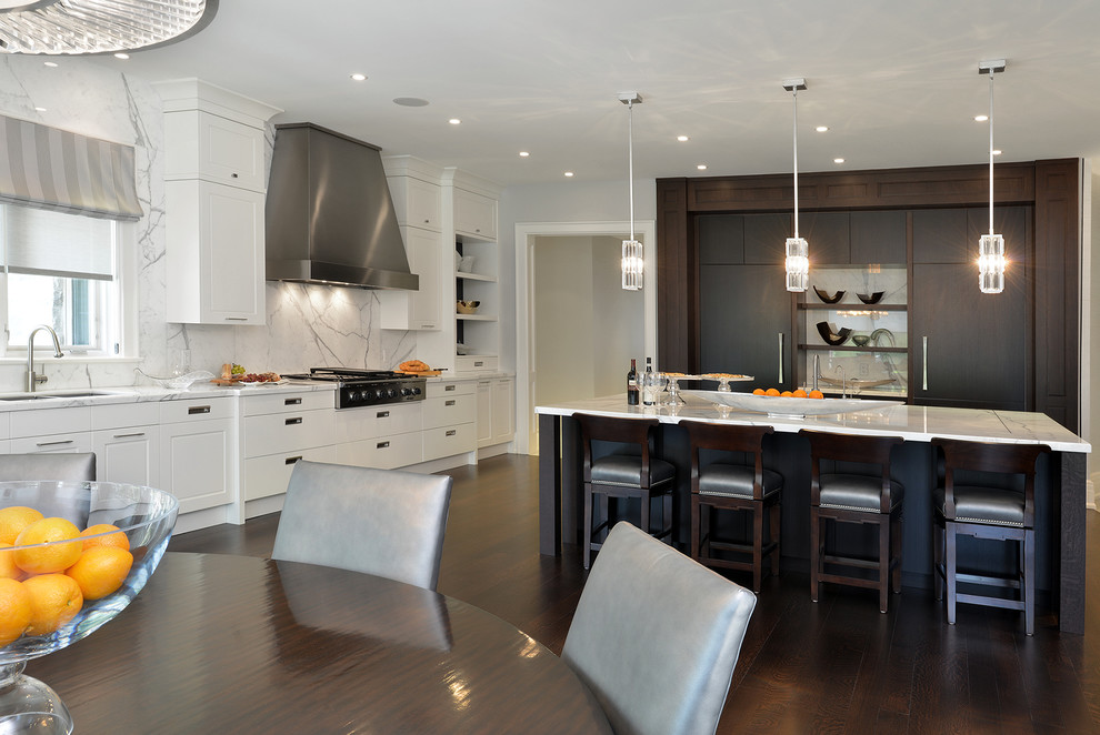 This is an example of a contemporary eat-in kitchen in Toronto with a double-bowl sink, flat-panel cabinets, white cabinets, white splashback and panelled appliances.