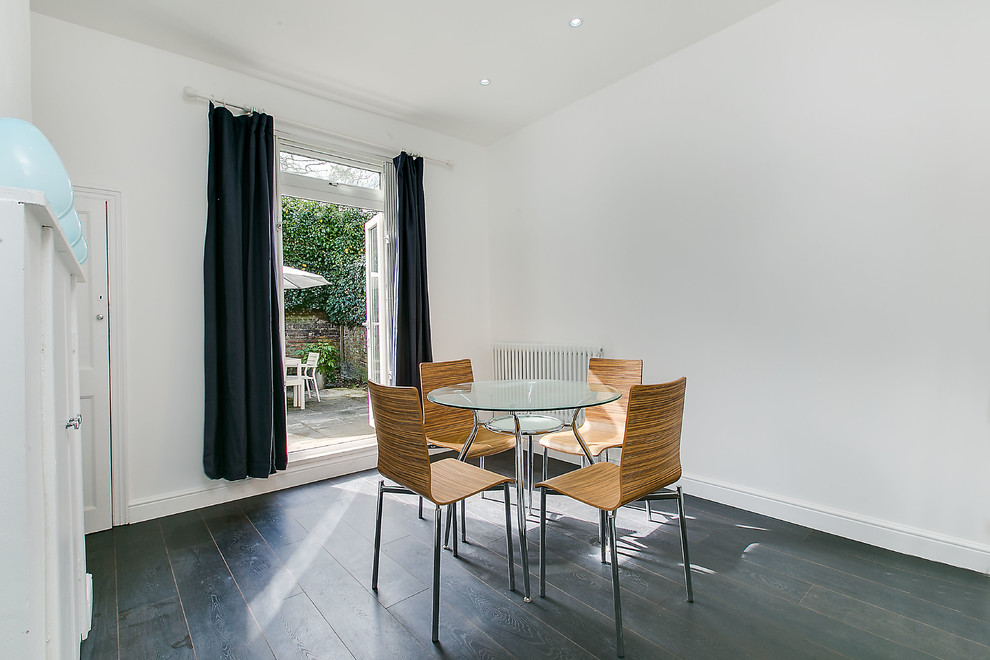 Design ideas for a small transitional dining room in London.