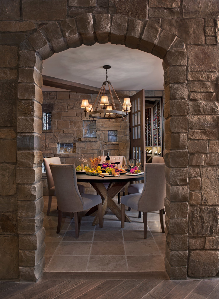 This is an example of a transitional wine cellar in Detroit with grey floor.