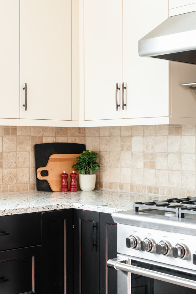Inspiration for a mid-sized transitional u-shaped medium tone wood floor and brown floor eat-in kitchen remodel with an undermount sink, shaker cabinets, distressed cabinets, quartz countertops, white backsplash, travertine backsplash, stainless steel appliances, a peninsula and multicolored countertops