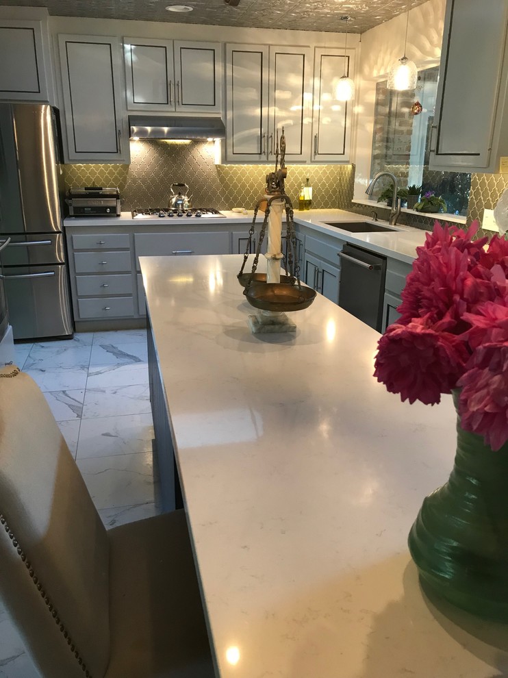 Enclosed kitchen - large transitional l-shaped marble floor and white floor enclosed kitchen idea in San Francisco with an undermount sink, shaker cabinets, gray cabinets, marble countertops, brown backsplash, ceramic backsplash, stainless steel appliances, an island and white countertops