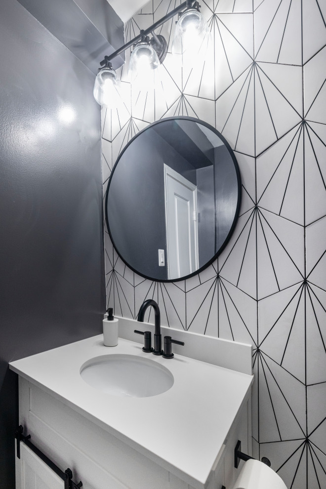Small country cloakroom in DC Metro with beaded cabinets, white cabinets, black and white tiles, porcelain tiles, grey walls, porcelain flooring, a submerged sink, engineered stone worktops, multi-coloured floors, white worktops and a freestanding vanity unit.