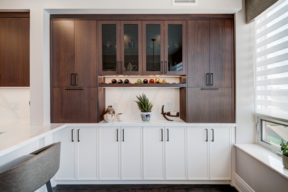 Inspiration for a mid-sized transitional u-shaped laminate floor and brown floor eat-in kitchen remodel in Toronto with an undermount sink, shaker cabinets, medium tone wood cabinets, quartzite countertops, white backsplash, stone slab backsplash, stainless steel appliances, a peninsula and white countertops