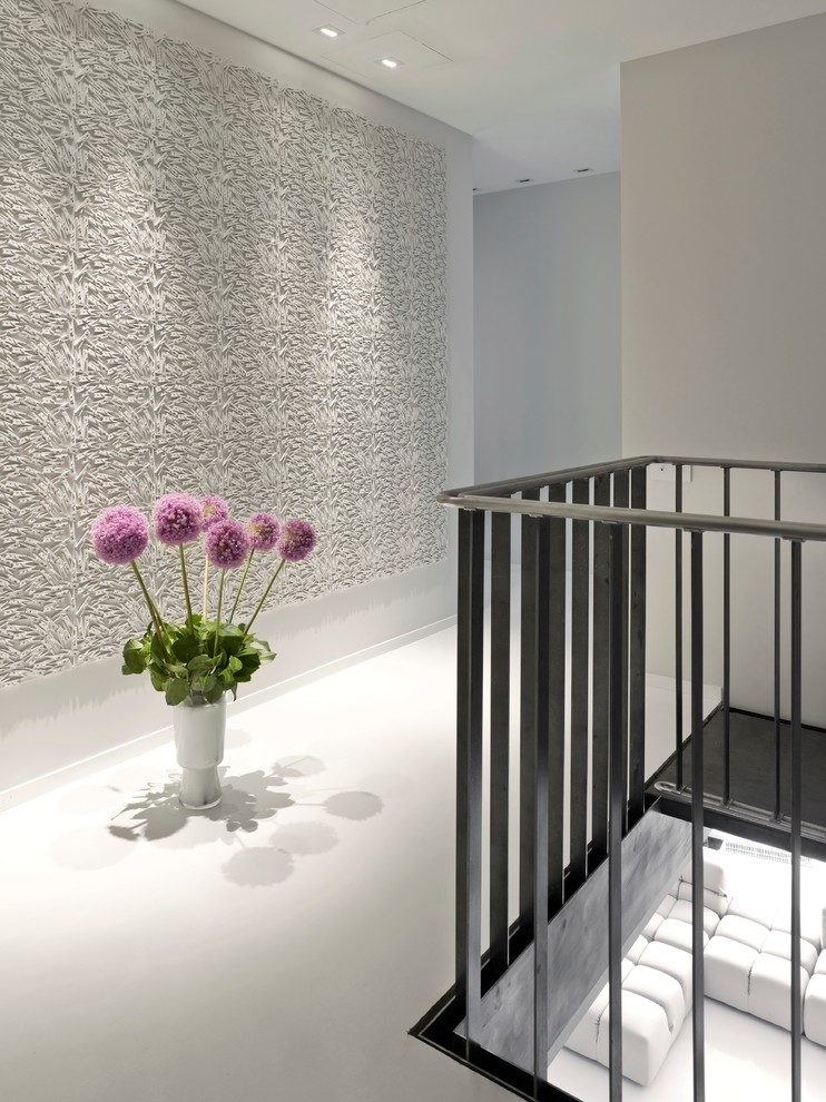 Design ideas for a contemporary hallway in Moscow with white walls and white floor.