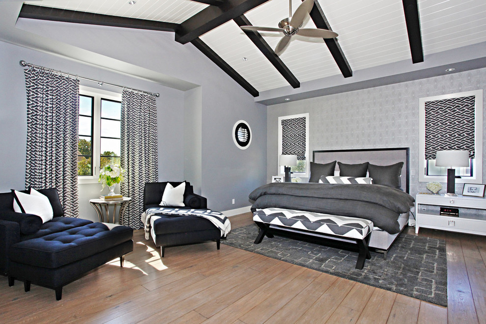 Contemporary bedroom in Orange County with grey walls.