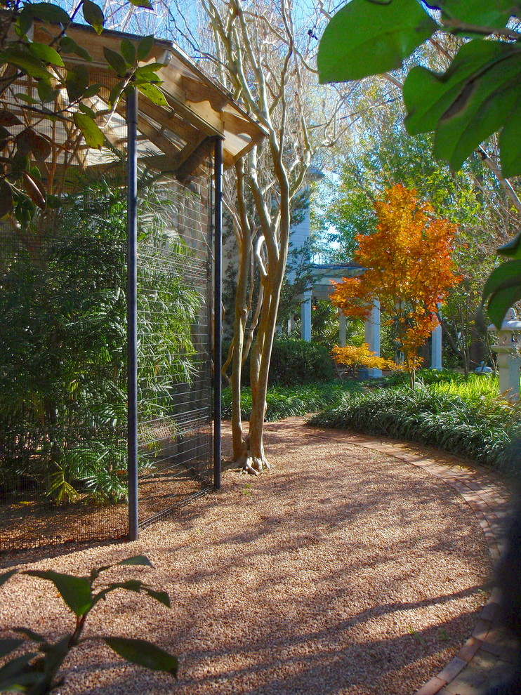 Photo of a large traditional backyard patio in Houston with a water feature, gravel and a gazebo/cabana.