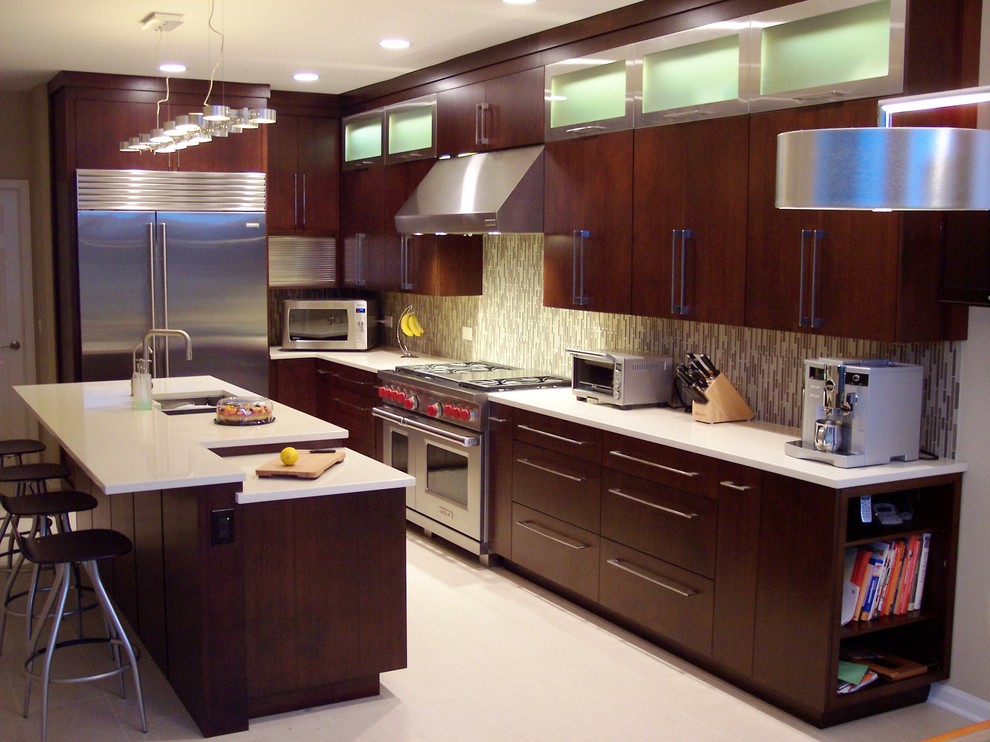 Inspiration for a mid-sized contemporary l-shaped eat-in kitchen in Chicago with a double-bowl sink, flat-panel cabinets, dark wood cabinets, solid surface benchtops, multi-coloured splashback, matchstick tile splashback, stainless steel appliances, porcelain floors, with island and white floor.