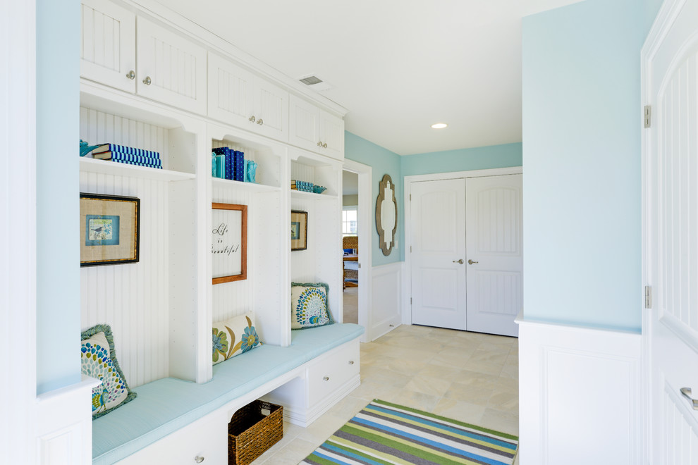 This is an example of a beach style mudroom in Other with blue walls, a double front door and a white front door.