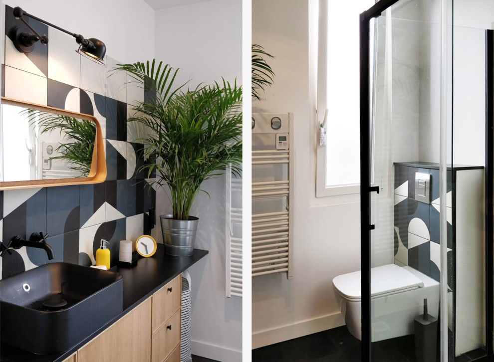 Example of a small master blue tile and cement tile concrete floor, black floor and single-sink bathroom design in Paris with beaded inset cabinets, a wall-mount toilet, white walls, a drop-in sink, laminate countertops, black countertops and a floating vanity