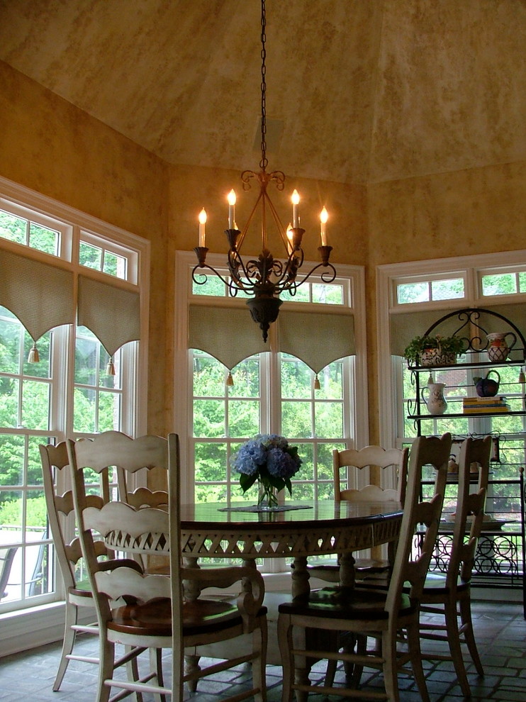 Photo of a mid-sized mediterranean dining room in Raleigh.