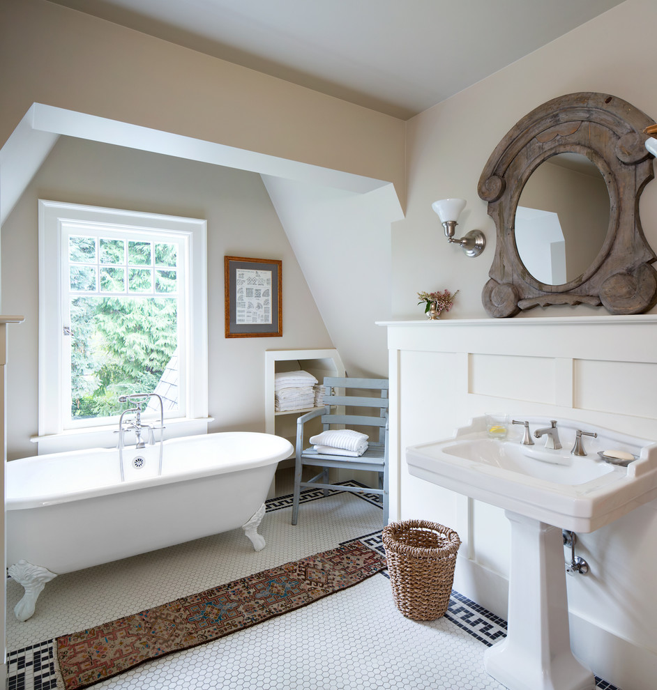 Inspiration for a transitional bathroom in Minneapolis with a pedestal sink, open cabinets, white cabinets, a claw-foot tub, white tile, mosaic tile, beige walls and mosaic tile floors.