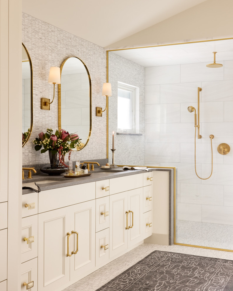 Walk-in shower - mid-sized transitional master multicolored tile and marble tile mosaic tile floor, gray floor, double-sink and vaulted ceiling walk-in shower idea in Denver with white cabinets, gray walls, an undermount sink, solid surface countertops, gray countertops, a built-in vanity and raised-panel cabinets