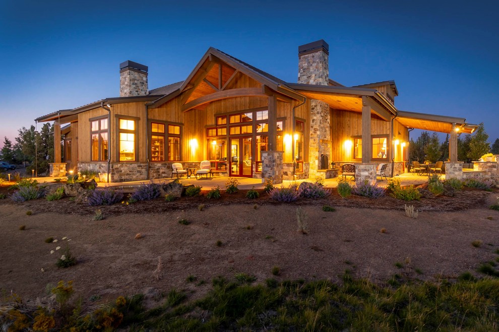 Inspiration for a large rustic brown two-story wood gable roof remodel