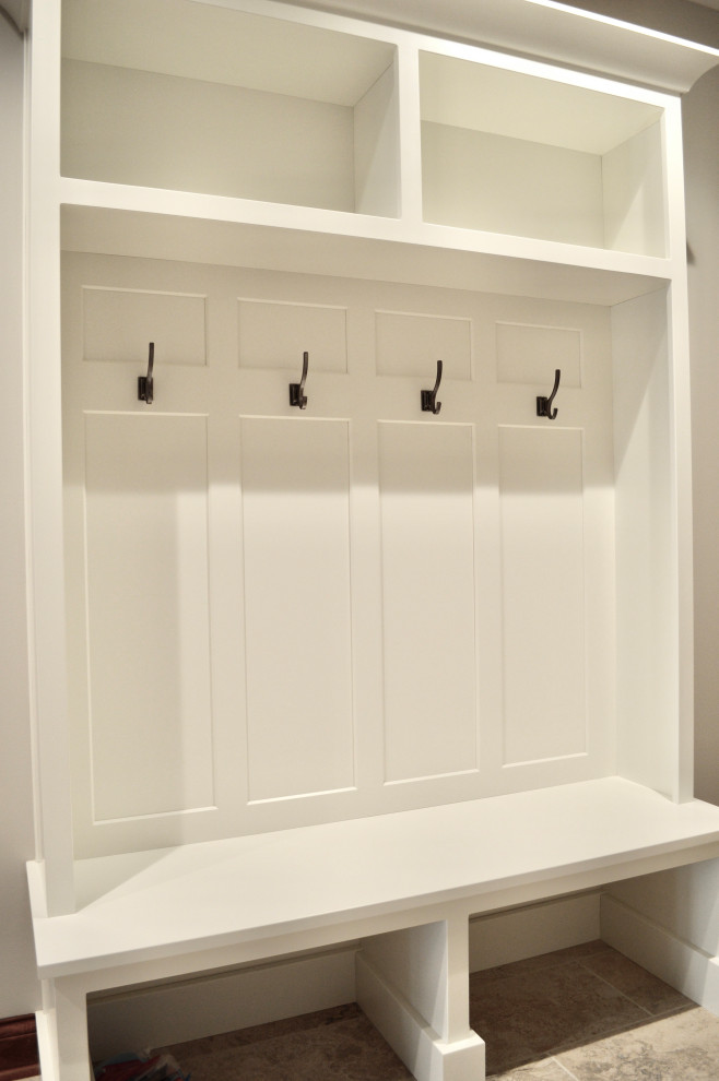Inspiration for a mid-sized transitional porcelain tile and beige floor mudroom remodel with gray walls and a brown front door