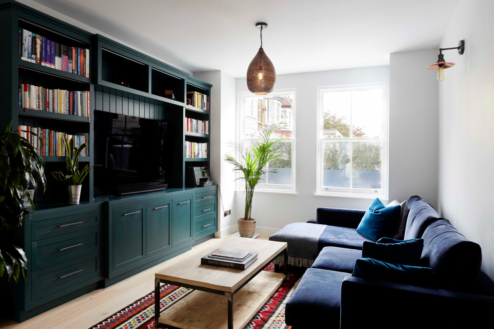 Photo of a transitional family room in London.