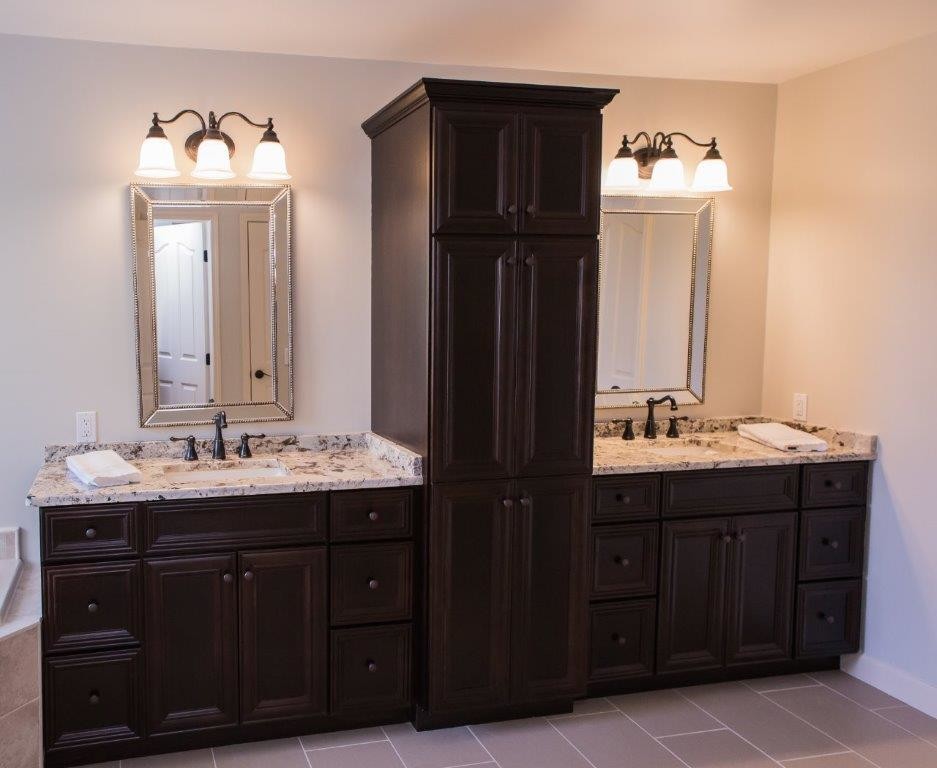 Inspiration for a large traditional master bathroom in Detroit with raised-panel cabinets, dark wood cabinets, a corner tub, an alcove shower, a two-piece toilet, beige tile, stone tile, white walls, vinyl floors, a drop-in sink, granite benchtops, beige floor, a sliding shower screen and beige benchtops.