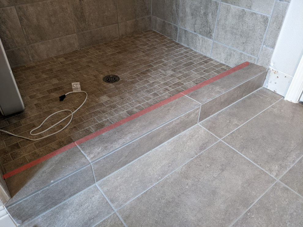 Tile shower curb grout cracked, hollow inside. What are my options?