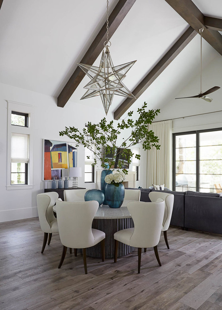 Cottage medium tone wood floor and gray floor great room photo in Miami with white walls