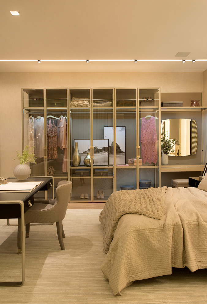 Design ideas for a contemporary bedroom in New York with beige walls and beige floor.