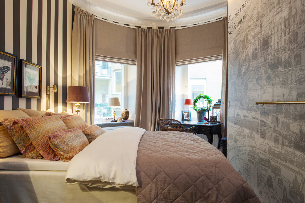 Photo of a large transitional master bedroom in Stockholm with grey walls and no fireplace.