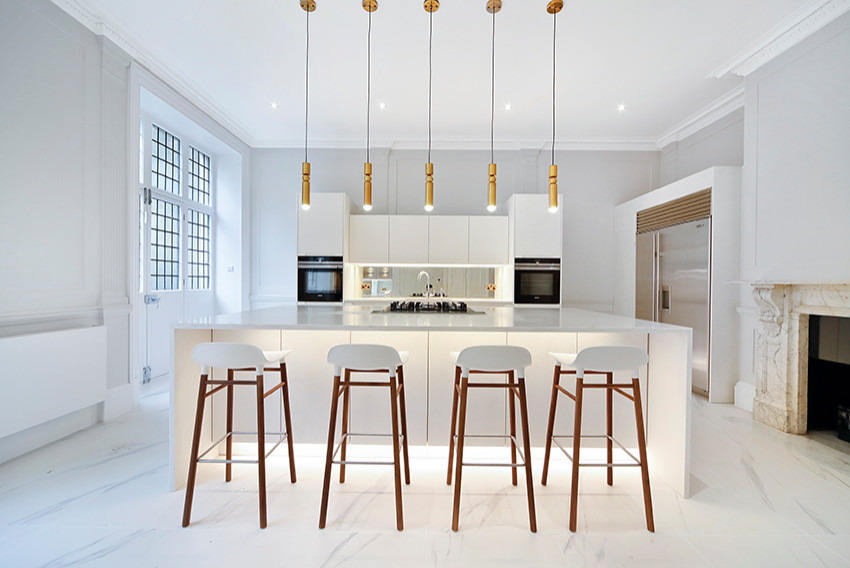 Inspiration for a modern white floor kitchen remodel in London with white cabinets, an island and white countertops